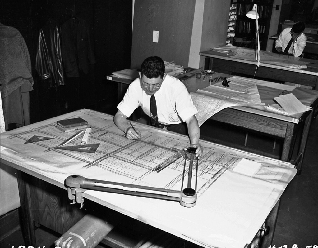 Architect working on an old drafting table